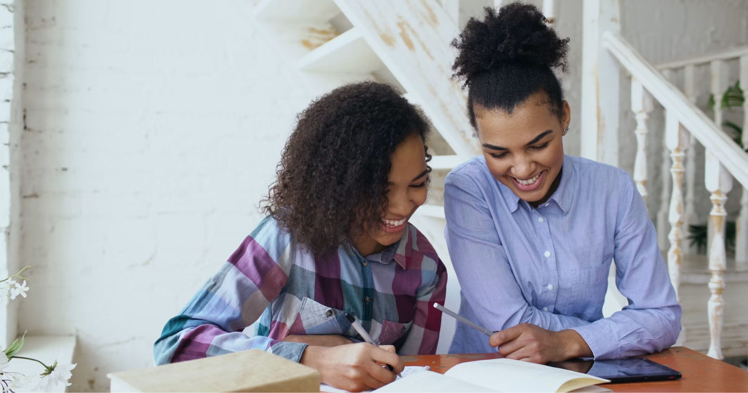 author working with a collaborator on a book outline